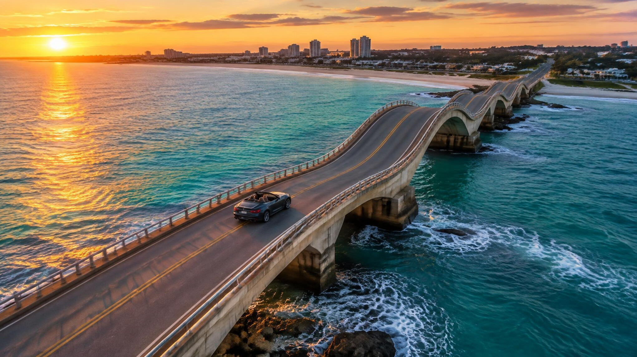 Aerial view of the wavy Puente de la Barra bridge in Punta del Este with a car crossing